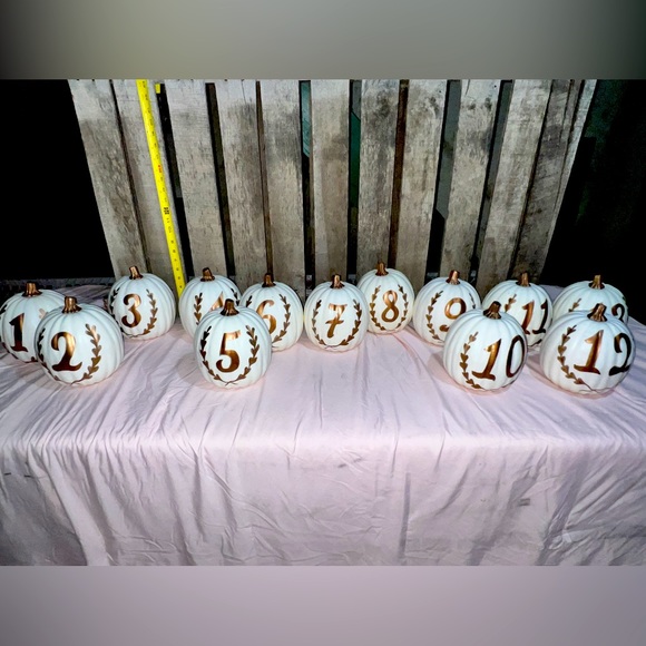 Rose gold table number pumpkins